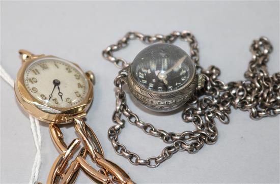 A ladys 1930s 9ct gold Buren manual wind wrist watch and a later globe watch pendant on chain.